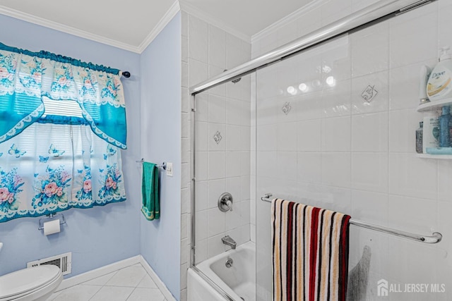 full bath featuring ornamental molding, tile patterned floors, toilet, enclosed tub / shower combo, and baseboards