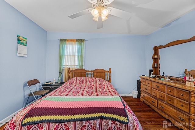 bedroom with dark wood finished floors and ceiling fan