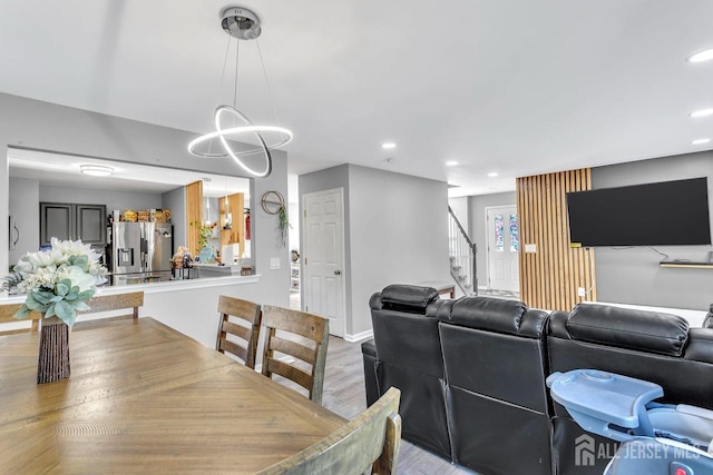 dining space with light hardwood / wood-style flooring