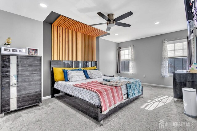 carpeted bedroom with ceiling fan