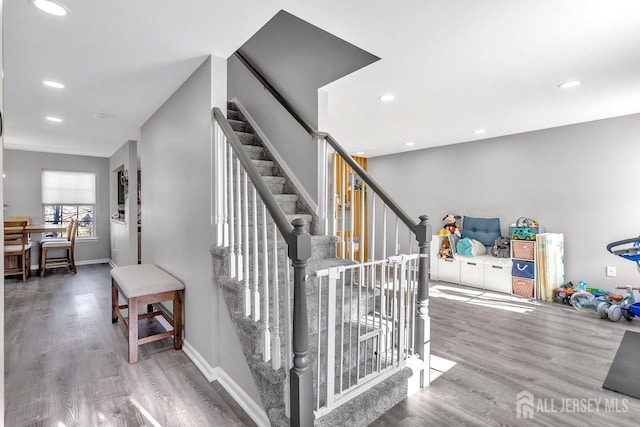 stairway with wood-type flooring