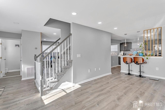 stairway featuring hardwood / wood-style flooring