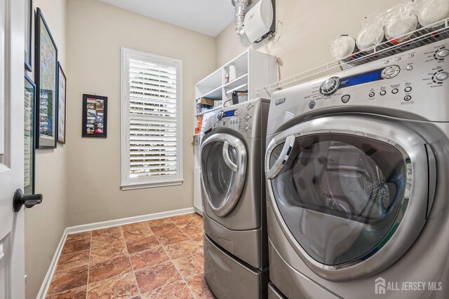 washroom with independent washer and dryer