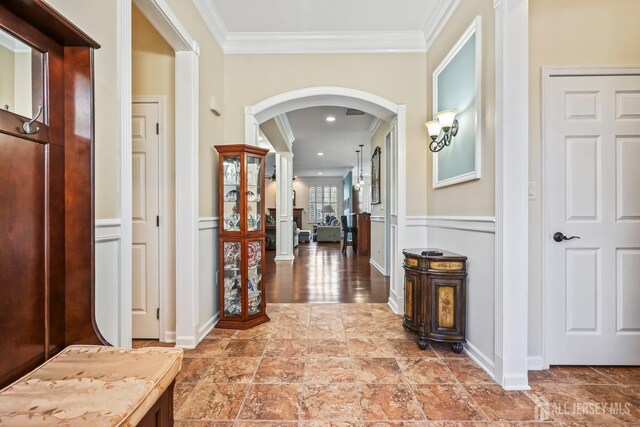 corridor featuring ornamental molding