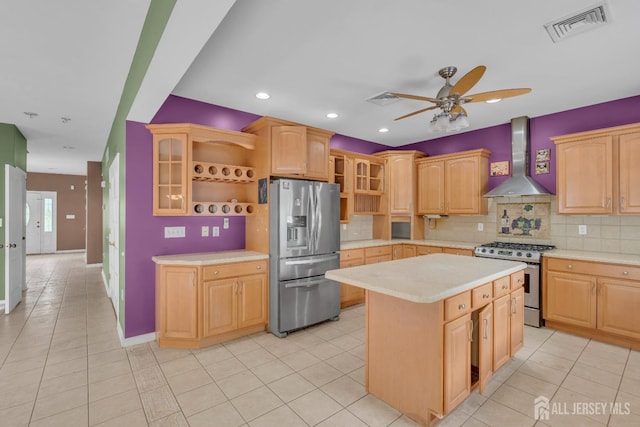 kitchen featuring visible vents, open shelves, light countertops, stainless steel appliances, and wall chimney exhaust hood