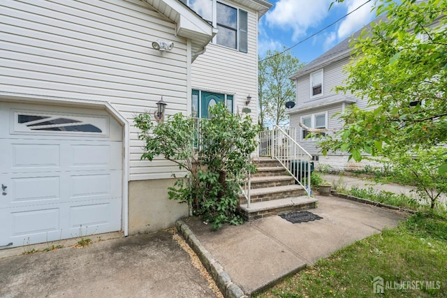 property entrance with a garage