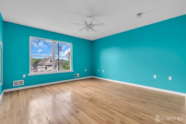 104 George St, South River, NJ 08882 - unfurnished room with a ceiling fan, wood finished floors, and a smoke detector