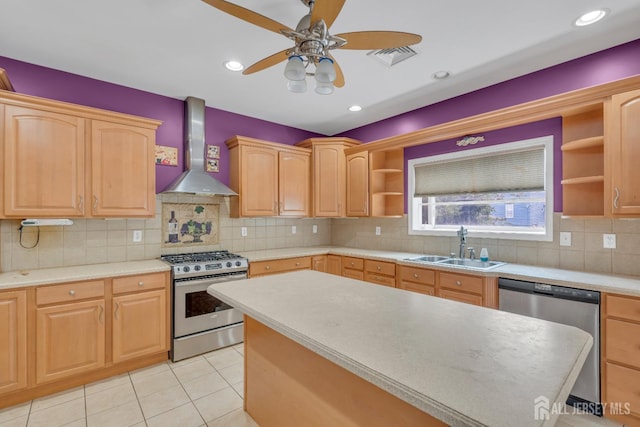 kitchen with wall chimney range hood, ceiling fan, open shelves, a sink, and stainless steel appliances