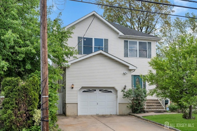 view of front of home with a garage and concrete driveway