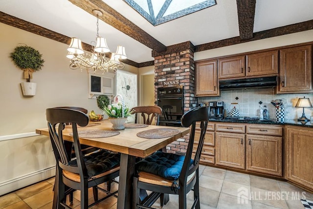 dining area with beamed ceiling, a baseboard heating unit, a skylight, light tile patterned floors, and a chandelier