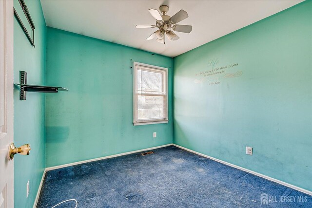 carpeted empty room with ceiling fan