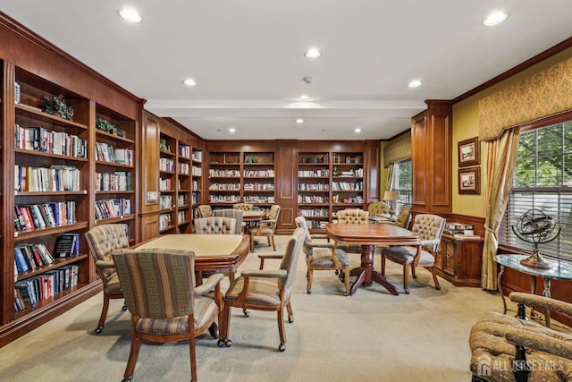 dining space featuring ornamental molding, light carpet, wainscoting, and recessed lighting