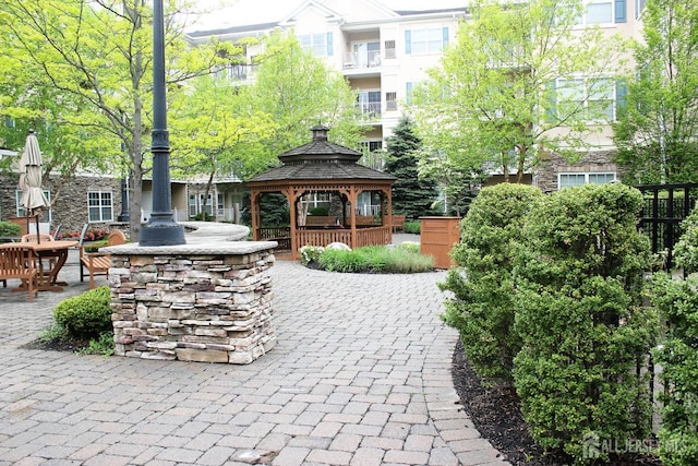view of property's community featuring a gazebo and a patio area