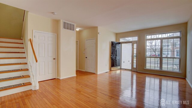 spare room featuring light wood-type flooring