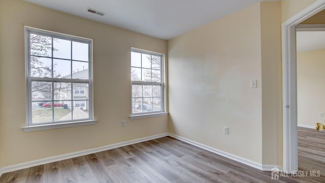 empty room with light wood-type flooring