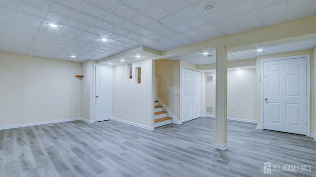 basement featuring light hardwood / wood-style flooring