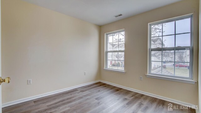 empty room with light wood-type flooring