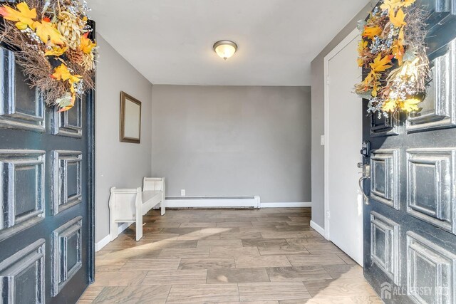 foyer featuring a baseboard radiator