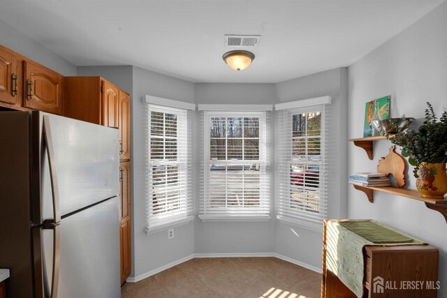 kitchen featuring stainless steel refrigerator