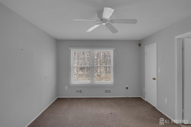 empty room featuring ceiling fan and carpet flooring