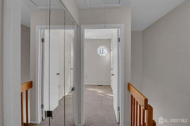 hallway featuring light carpet