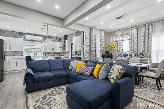 207 S Broadway, South Amboy, NJ 08879 - living room featuring light wood-style flooring, recessed lighting, and a chandelier