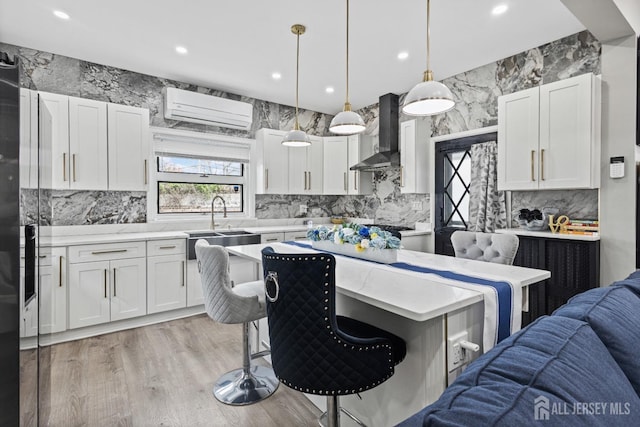 207 S Broadway, South Amboy, NJ 08879 - kitchen with wall chimney exhaust hood, open floor plan, light countertops, a kitchen breakfast bar, and decorative backsplash