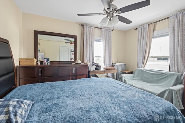 207 S Broadway, South Amboy, NJ 08879 - bedroom with multiple windows, radiator, and a ceiling fan