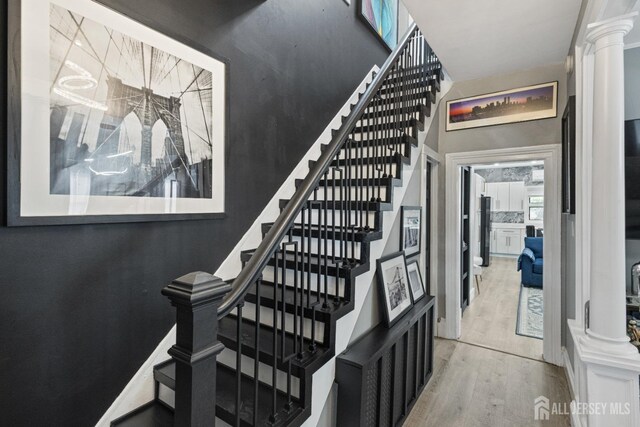207 S Broadway, South Amboy, NJ 08879 - staircase featuring wood finished floors and ornate columns