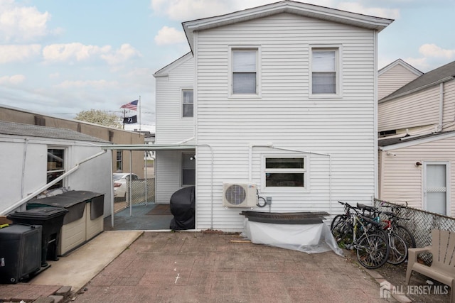 207 S Broadway, South Amboy, NJ 08879 - back of property featuring a cooling unit, a patio, and fence