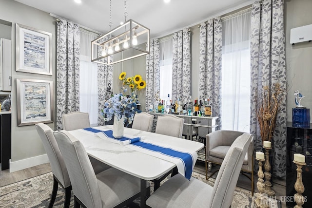 207 S Broadway, South Amboy, NJ 08879 - dining room featuring wood finished floors, baseboards, and a chandelier