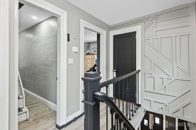 207 S Broadway, South Amboy, NJ 08879 - corridor featuring an upstairs landing, light wood-style floors, and baseboards