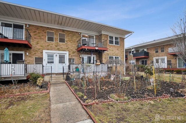 view of property with brick siding