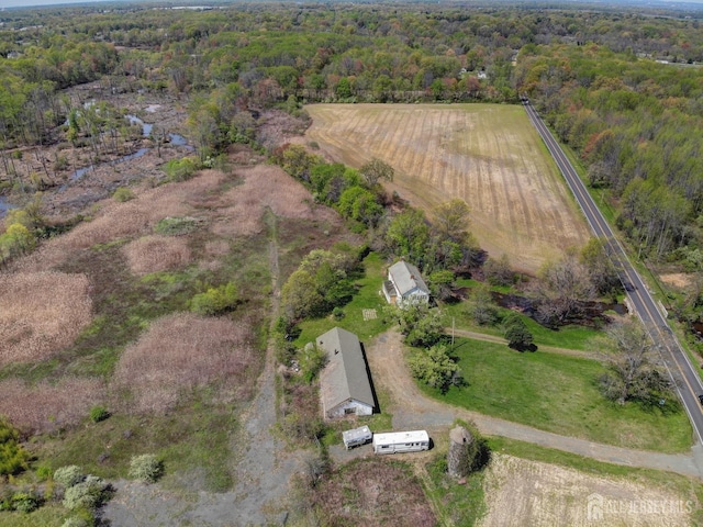 aerial overview of property's location featuring a heavily wooded area and rural landscape