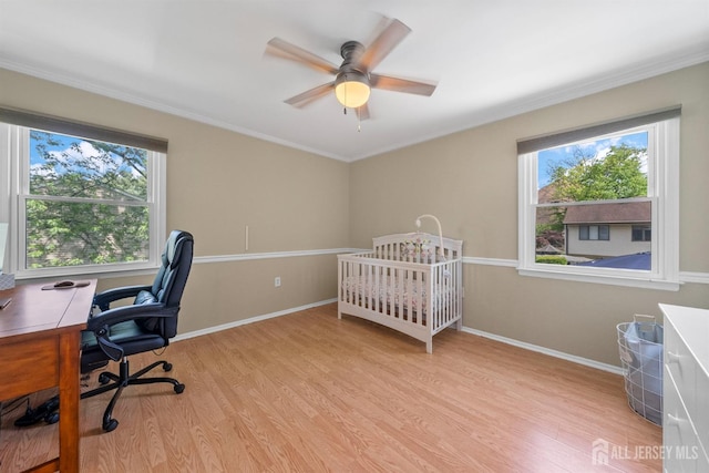 bedroom with light wood-style flooring, ornamental molding, baseboards, an office area, and ceiling fan
