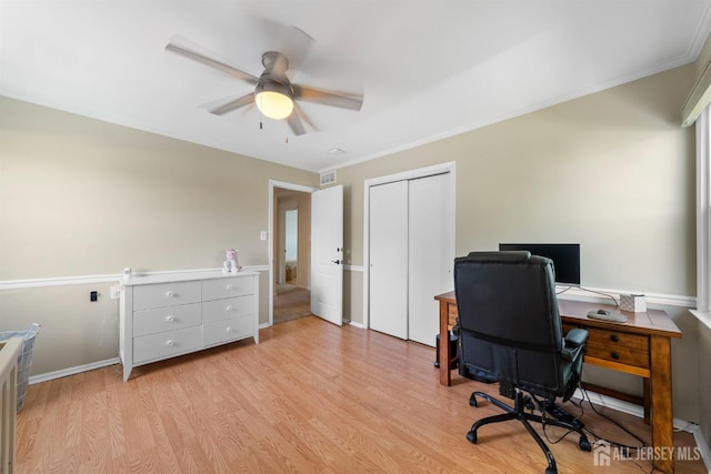 office space with ceiling fan, light wood-type flooring, ornamental molding, and baseboards