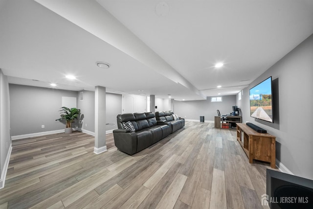 living area featuring light wood-type flooring, baseboards, and recessed lighting