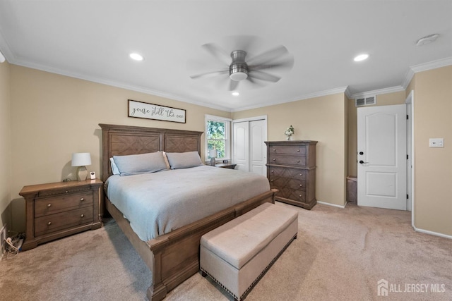 bedroom with a closet, light colored carpet, recessed lighting, crown molding, and a ceiling fan