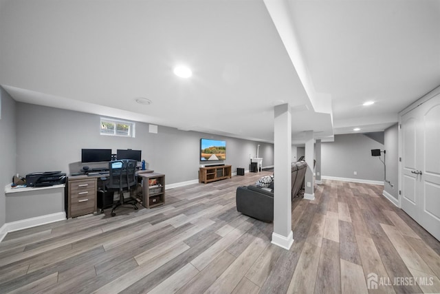 home office featuring light wood-type flooring, baseboards, and recessed lighting