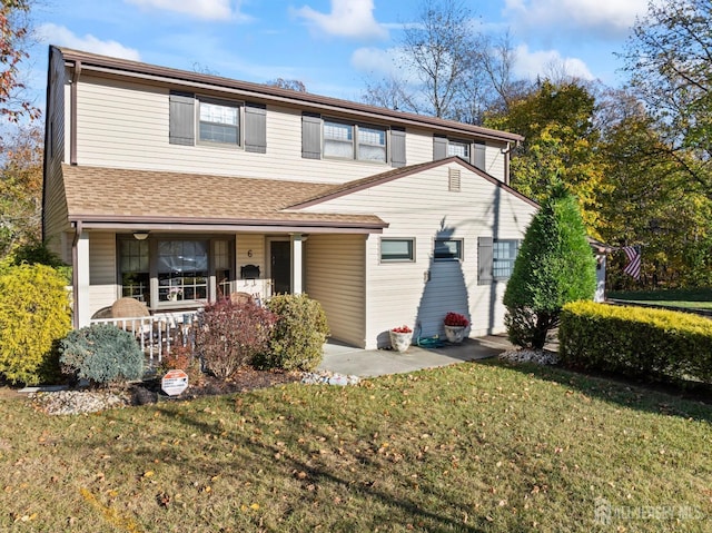 front facade featuring a front lawn and a porch