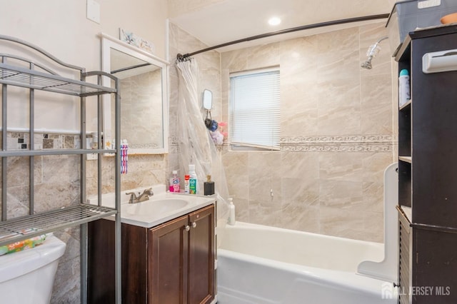 full bath featuring shower / bath combination with curtain, vanity, and toilet