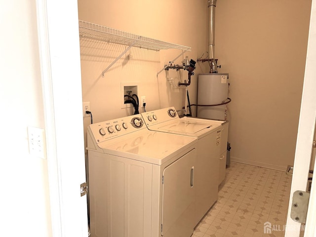 laundry room with gas water heater and independent washer and dryer