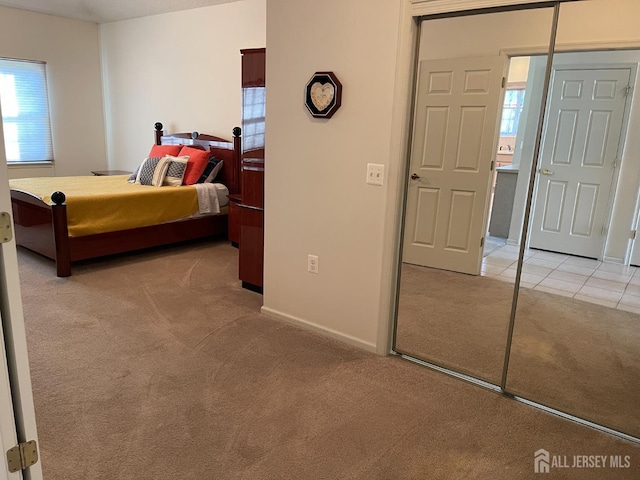 carpeted bedroom featuring a closet