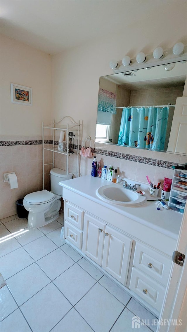 20 Ballo Pl, Edison, NJ 08820 - bathroom with tile walls, tile patterned flooring, vanity, a shower with shower curtain, and a wainscoted wall