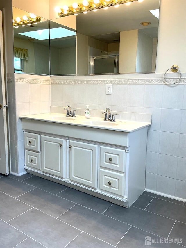 20 Ballo Pl, Edison, NJ 08820 - full bath featuring tile walls, tile patterned floors, and double vanity