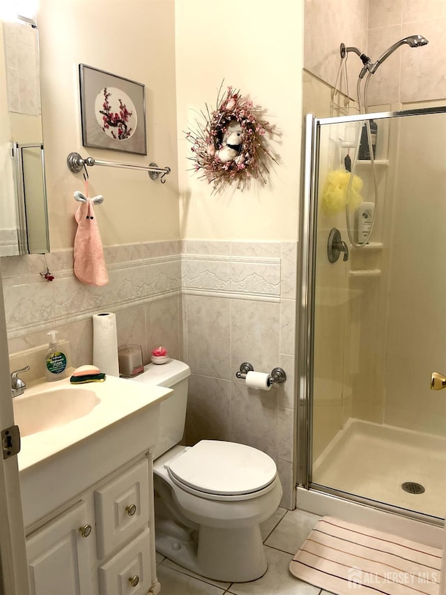 20 Ballo Pl, Edison, NJ 08820 - full bath featuring a stall shower, vanity, tile walls, tile patterned flooring, and wainscoting