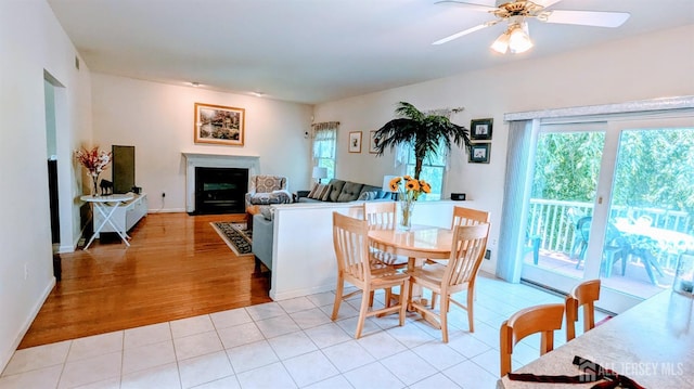 20 Ballo Pl, Edison, NJ 08820 - dining room with ceiling fan, a fireplace with flush hearth, and light wood-type flooring