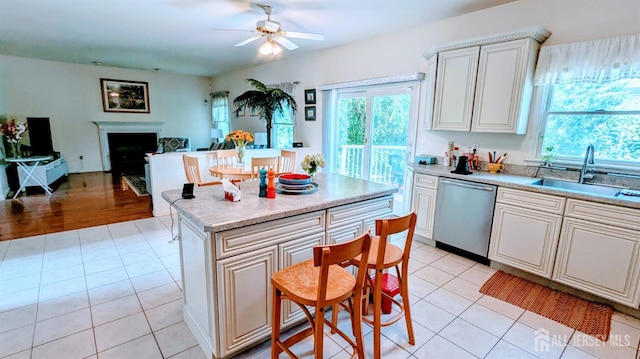 20 Ballo Pl, Edison, NJ 08820 - kitchen with stainless steel dishwasher, healthy amount of natural light, and light tile patterned floors