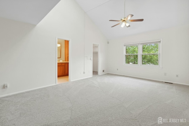 7 Tisbury Ct, Scotch Plains, NJ 07076 - unfurnished bedroom featuring high vaulted ceiling, a walk in closet, light carpet, ensuite bathroom, and ceiling fan