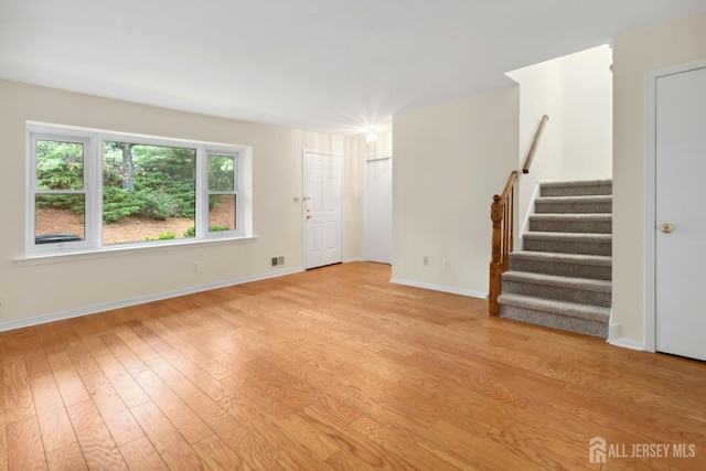7 Tisbury Ct, Scotch Plains, NJ 07076 - unfurnished living room with stairs and light wood-style floors